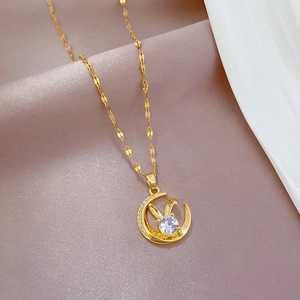 Elegant gold rabbit and moon pendant necklace with zircon on soft pink silk