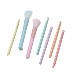 7-piece colorful macaron makeup brush set for powder, blush, and eyeshadow on white background