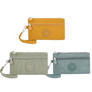 Three-layer nylon wristlet bags in yellow, green and blue with metal zippers and round logo
