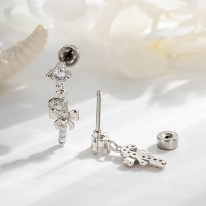 Silver bow candy cane piercing stud with zircon inlays on a clean white background