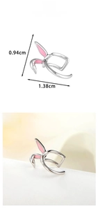 Detail view of rabbit ear ear cuff showing pink enamel inlay and 1.38cm diameter size