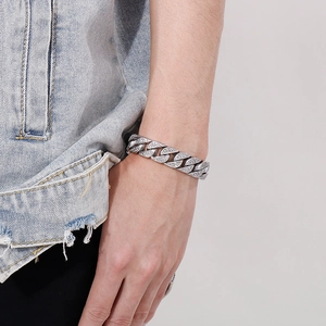 Close-up of hip hop silver Cuban chain bracelet with full zircon rhinestones on a wrist
