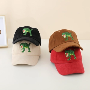Detail view of four cotton baseball caps with green dinosaur embroidery in various colors