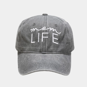 Detail of mom LIFE white embroidery on vintage washed cotton curved brim baseball cap