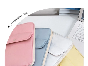 Detailed view of quilted laptop bags in pink, blue, white, and yellow colors