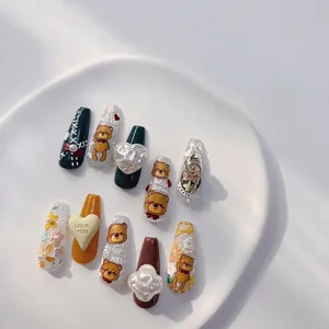 3D embossed press-on nails featuring cute cartoon bears, pearls, and colorful floral patterns