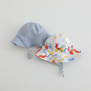 Detail view of cotton kids bucket hats in light blue and colorful abstract line pattern