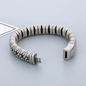 Close-up of vintage silver stainless steel bracelet with textured link and pin clasp