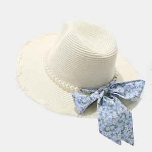 Chic beige raffia sun hat for women with pearl trim and blue floral bow ribbon detailing