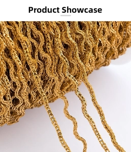 Macro detail of 1.2mm golden stainless steel wavy foxtail chain for jewelry DIY