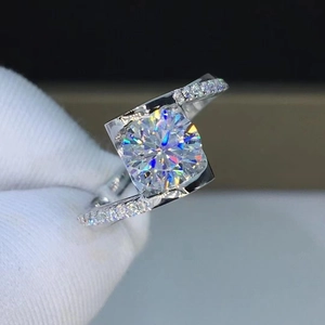 Macro shot of silver twisted band ring with large round solitaire and side accents