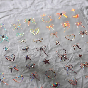 Holographic 3D bow and heart nail art stickers with sparkling laser finish and tiny rhinestones