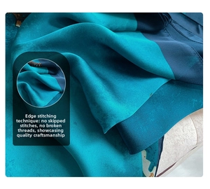 Detail of high-quality stitching and smooth teal satin fabric texture on the scarf