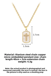 Detailed view of shell cross pendant with dimensions 2.7x1.3cm and 40+5cm chain length