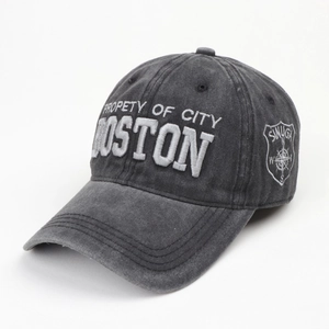 Detail of gray washed baseball cap with Boston 3D embroidery and side shield patch