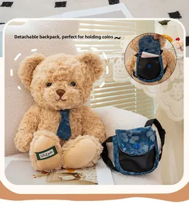 Detail of light brown teddy bear with removable blue denim backpack and soft plush texture