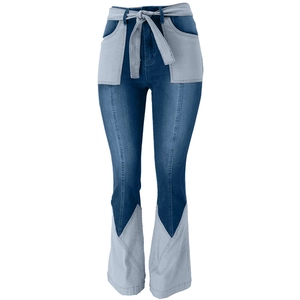 Close-up of contrast denim patchwork and stitching on high-waisted flare jeans