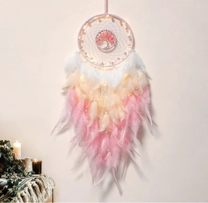 Detail of pink Tree of Life dream catcher with soft gradient white and pink feathers