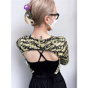 Detailed back view of a Yin Yang hair claw clip with a street style graffiti crop top