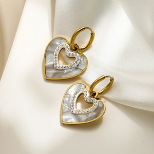 Elegant heart-shaped gold drop earrings with mother of pearl and sparkling crystals