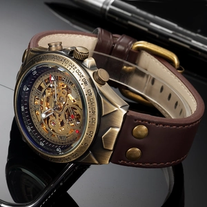 Close-up of retro skeleton mechanical watch with bronze case and brown leather strap