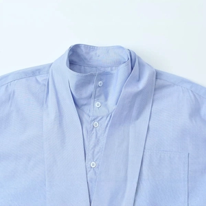 Light blue minimalist stand-up collar shirt with buttoned placket and chest pocket