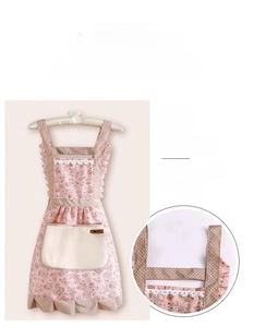 Detail of floral kitchen apron with wide shoulder straps and large waterproof pocket