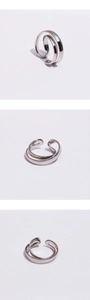 Detailed views of silver irregular double-layered cross ring from multiple angles