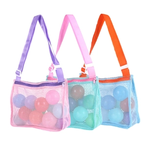 Mesh beach toy storage bags in pink, teal and blue with adjustable shoulder straps