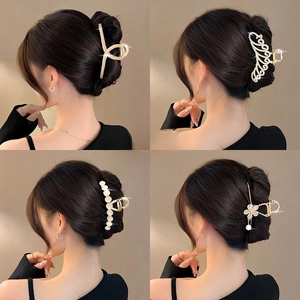 Elegant 11cm metal pearl hair claw clips featuring four stylish designs for hair buns