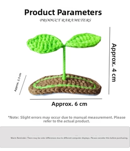 Macro detail showing dimensions of handmade green crochet sprout hair clip for girls