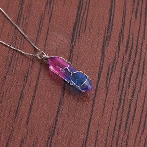 Handcrafted hexagonal crystal pendant necklace with blue and pink gradient wrapped in silver wire
