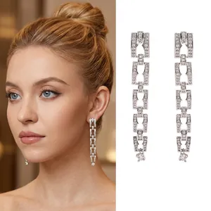 Silver geometric chain earrings with sparkling zircons shown as model and product view