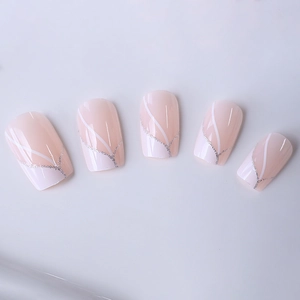 Square press-on nails with white swirl lines and silver glitter on nude gradient base