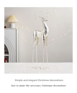 Close-up of silver Christmas reindeer figurine with elegant curved antlers for decor