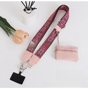 Pink and green woven crossbody phone strap with a matching leather coin purse detail