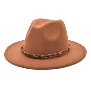Detail of wool fedora hat with brown leather braided band and bronze skull star buckle