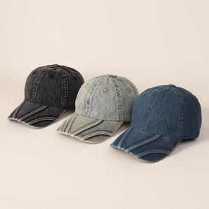Detail of three washed denim baseball caps with unique layered double brim design