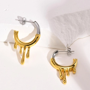 Irregular fluid lava teardrop C-shaped earrings in two-tone gold and silver finish