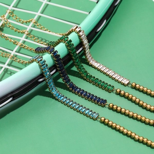 Colorful zircon beaded bracelets in blue, green, and white on a creative tennis racket backdrop