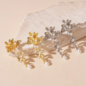 Elegant floral pearl drop earrings in gold and silver finish with leaf metal tassels