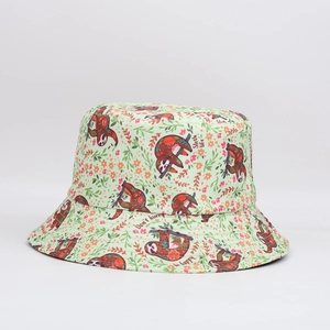 Detail of light green bucket hat fabric featuring colorful sloth and floral digital prints