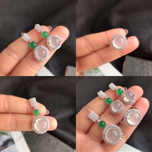 Detailed view of translucent chalcedony jewelry set including earrings, ring, and pendant