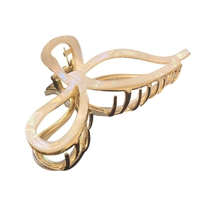 Elegant gold metal hair claw clip with pearlescent cream acrylic butterfly wings