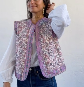 Detailed view of bohemian purple floral quilted vest with high-quality stitching texture