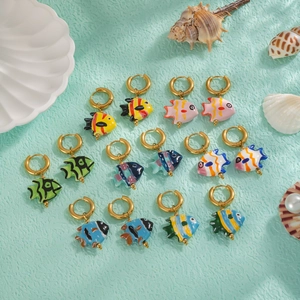 Set of eight pairs of colorful ceramic koi fish earrings with ocean themed shell props