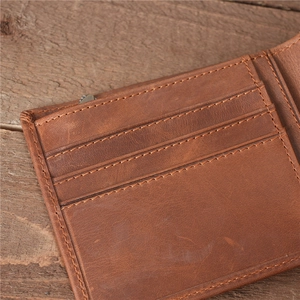 Detailed close-up of brown vintage leather wallet interior with multiple card slots