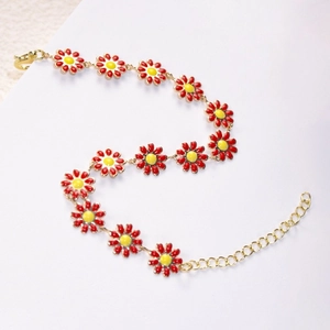 Detail view of the red daisy flower bracelet with gold alloy links and lobster clasp