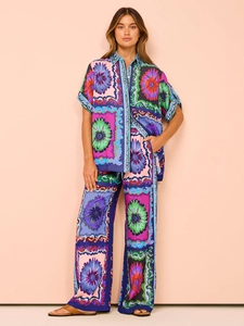 Full view of women's summer set with floral short sleeve shirt and wide leg trousers