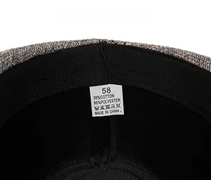 Macro detail of hat inner lining with size label showing 35% cotton 65% polyester fabric